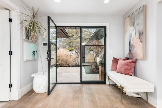 doorway to outside with light hardwood / wood-style flooring