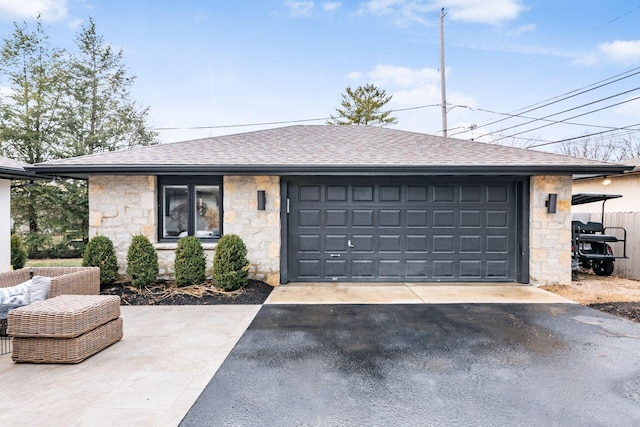 ranch-style house featuring a garage