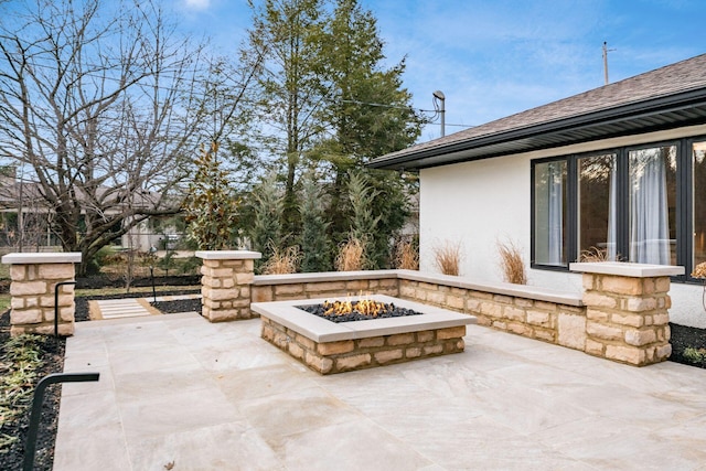 view of patio / terrace with a fire pit