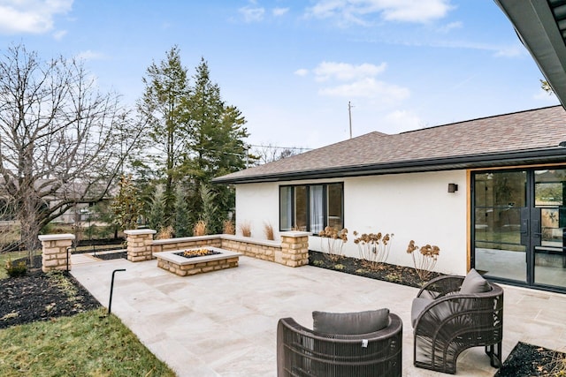 view of patio / terrace with an outdoor fire pit