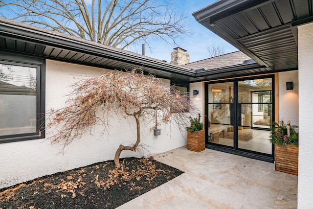 entrance to property with a patio area