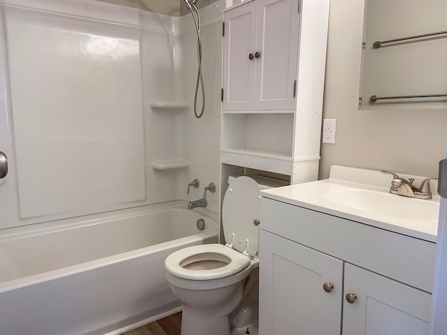 full bathroom featuring hardwood / wood-style floors, vanity, toilet, and tub / shower combination