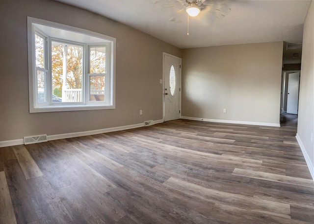 unfurnished room with ceiling fan and dark hardwood / wood-style floors