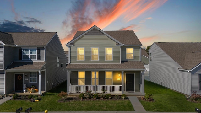 view of front of home featuring a porch and a lawn