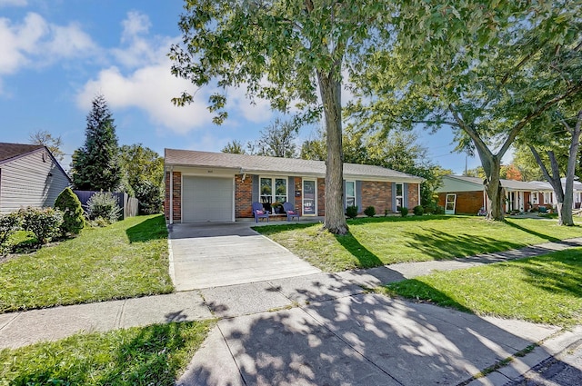 single story home featuring a garage and a front yard