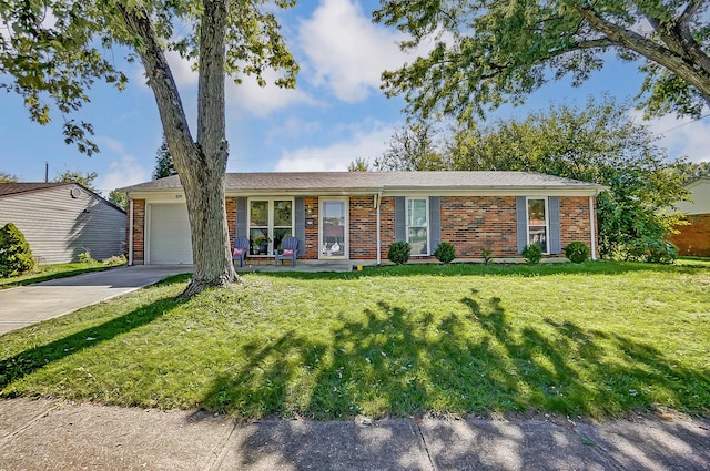 ranch-style home with a front yard and a garage