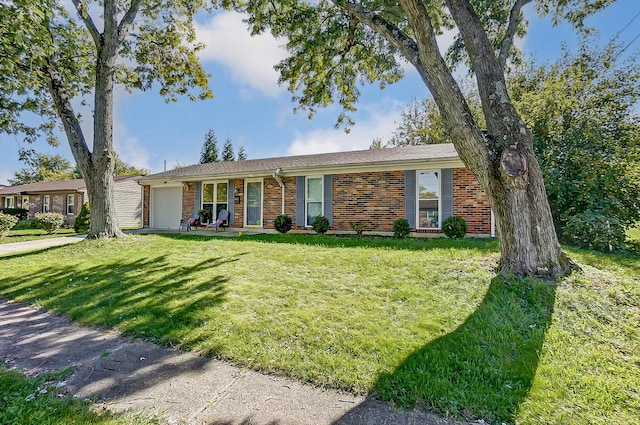 single story home featuring a front yard and a garage