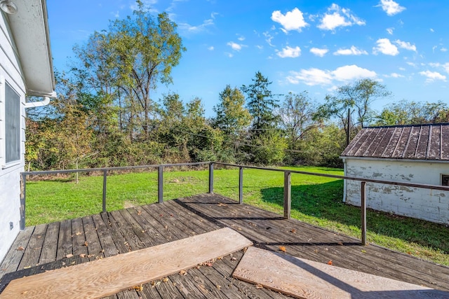 wooden terrace with a lawn