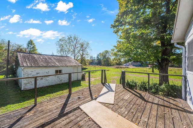 wooden terrace with a lawn