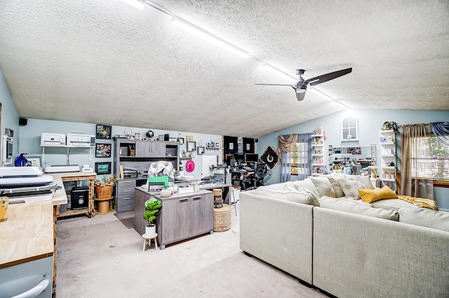 living room with a textured ceiling, vaulted ceiling, and ceiling fan