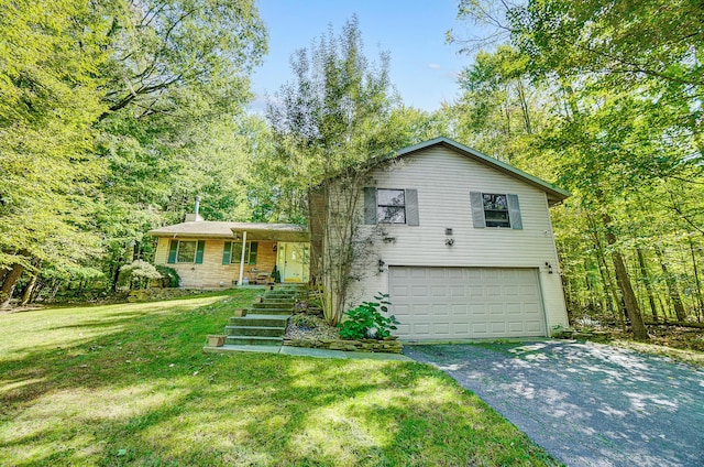 split level home with a front lawn and a garage