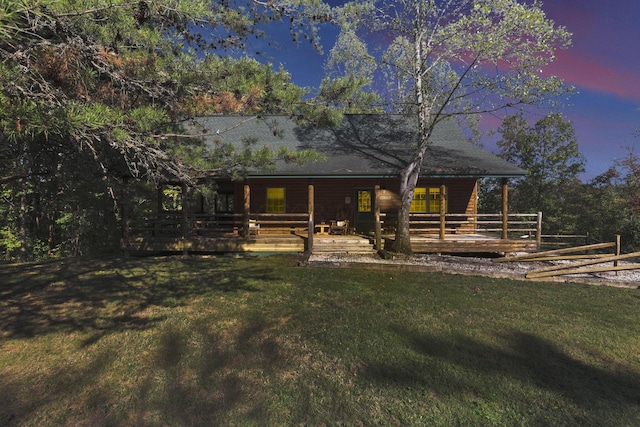 log-style house with a lawn