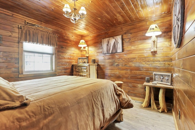 bedroom with a chandelier, wooden walls, wooden ceiling, and hardwood / wood-style flooring