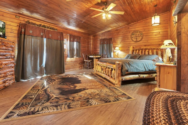 bedroom featuring hardwood / wood-style floors, wooden walls, vaulted ceiling, and wooden ceiling