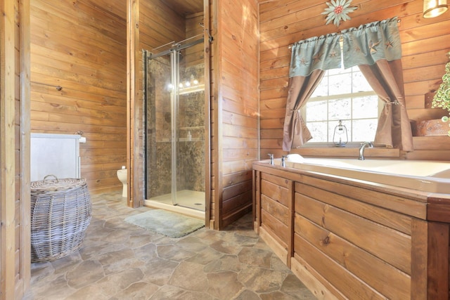 bathroom with an enclosed shower, toilet, and wooden walls