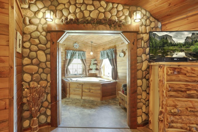 bathroom with a bathing tub, wood-type flooring, lofted ceiling, and wooden ceiling