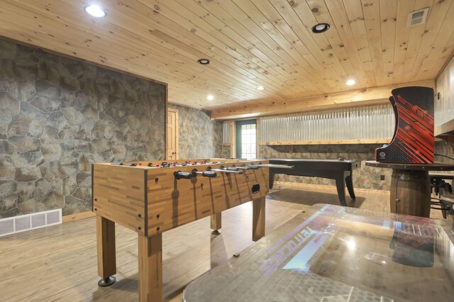 recreation room featuring light hardwood / wood-style floors and wooden ceiling