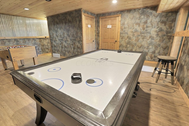 game room featuring wood ceiling and hardwood / wood-style flooring