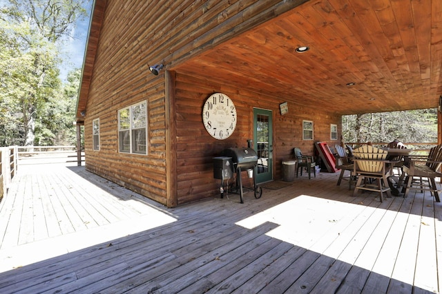 wooden terrace featuring a grill