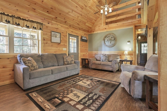 living room featuring hardwood / wood-style flooring, high vaulted ceiling, and plenty of natural light