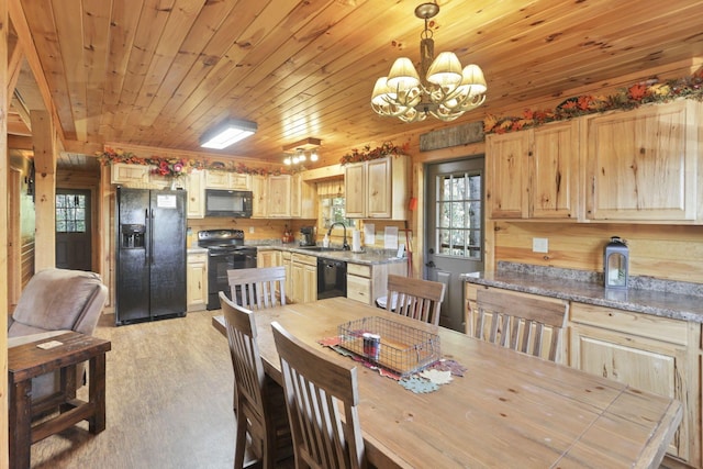 dining space with light hardwood / wood-style flooring, wood ceiling, a notable chandelier, and sink