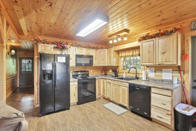 kitchen featuring light wood-type flooring, wood ceiling, sink, black appliances, and wood walls