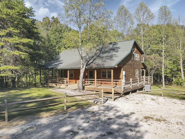 log home featuring a deck and central air condition unit