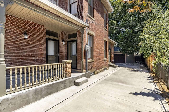 view of side of property featuring a garage and an outdoor structure