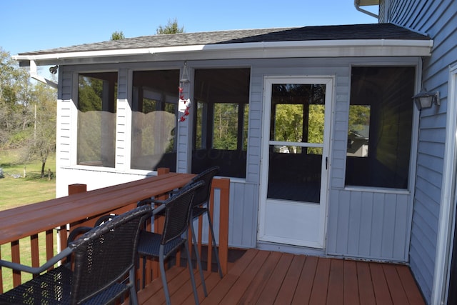 wooden deck featuring a sunroom