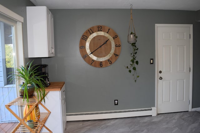 entryway with a baseboard heating unit