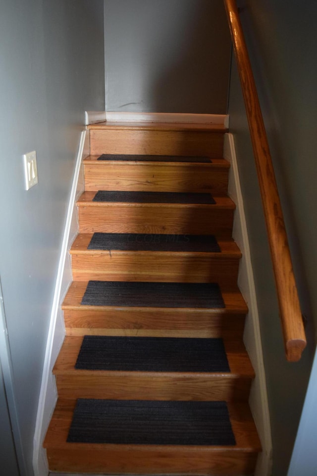 stairs with wood-type flooring