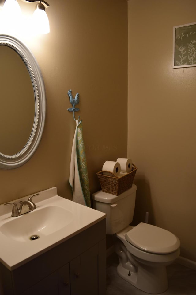 bathroom with vanity and toilet