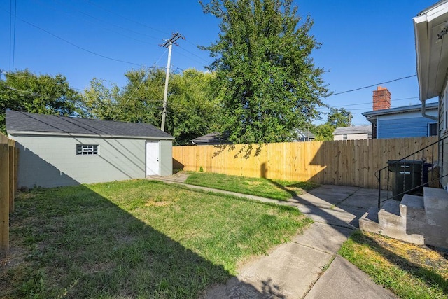 view of yard with an outdoor structure, a patio area, and central air condition unit