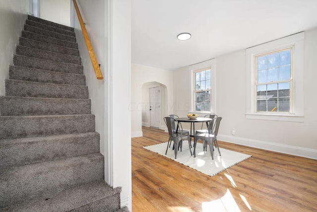 stairway featuring hardwood / wood-style floors