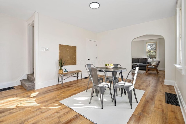 dining space featuring hardwood / wood-style flooring