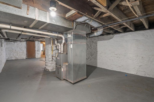 basement featuring heating unit