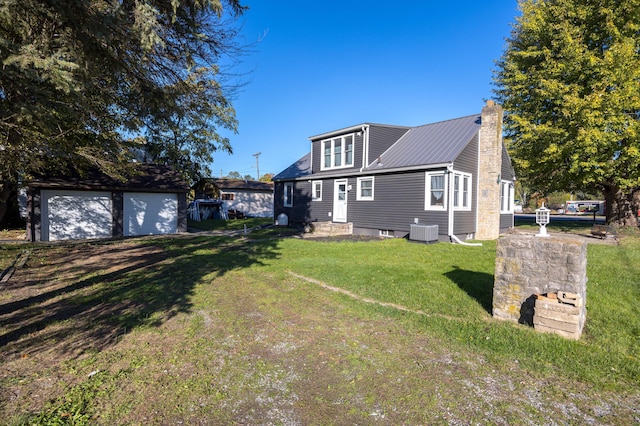 exterior space with an outdoor structure, a yard, and central AC