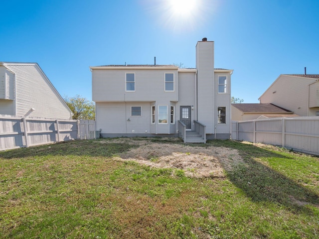 back of house with a yard and cooling unit