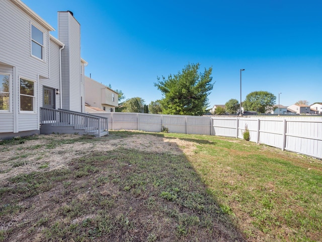 view of yard featuring a deck