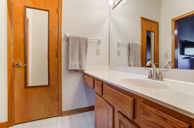 bathroom with tile patterned floors and vanity