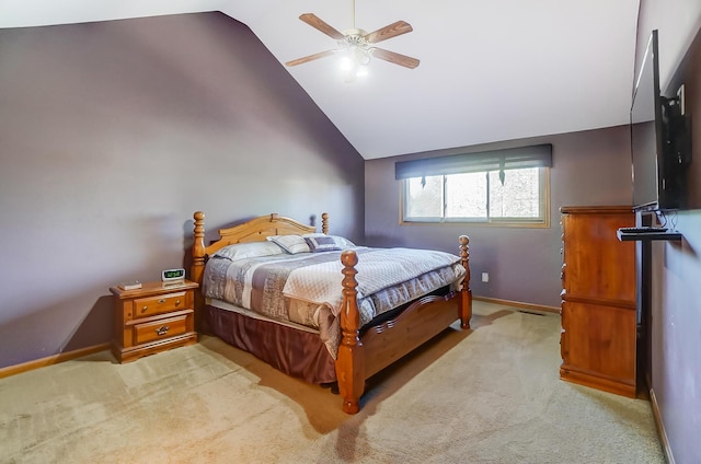 carpeted bedroom with ceiling fan and vaulted ceiling