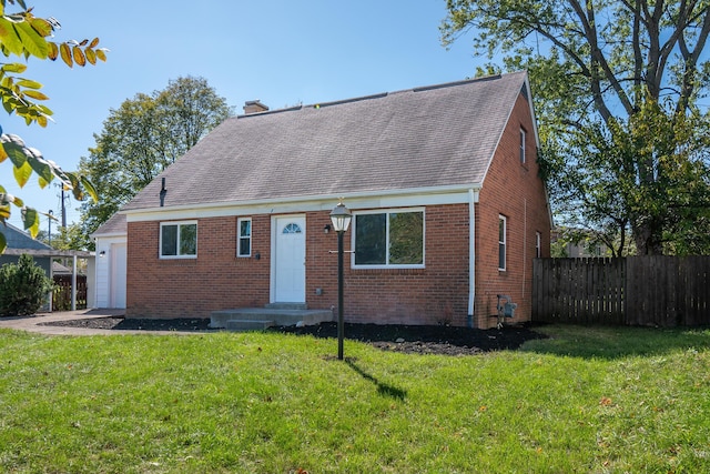 view of front of home featuring a garage and a front lawn