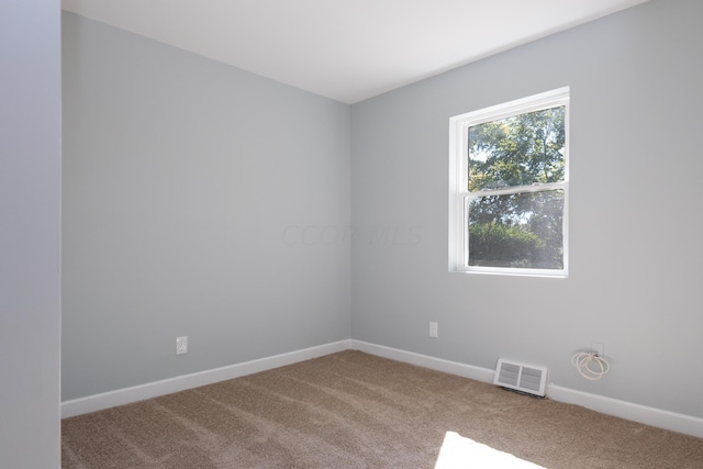 empty room with carpet flooring