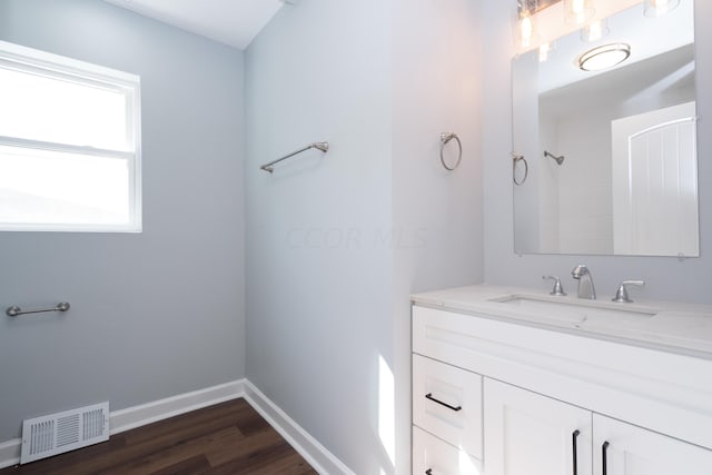 bathroom with wood-type flooring and vanity