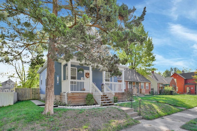 view of front facade with a porch and a front yard