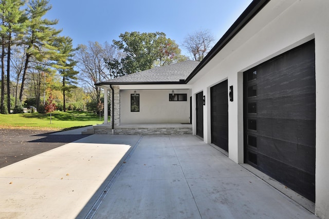 view of patio / terrace featuring a garage