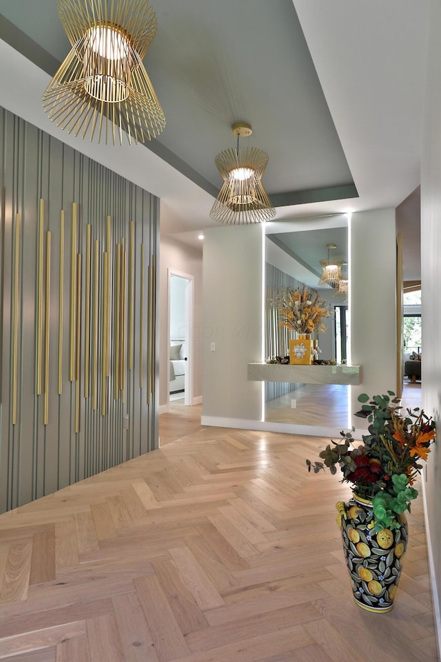 dining space featuring light parquet floors and an inviting chandelier