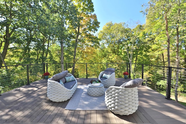 wooden terrace with an outdoor hangout area