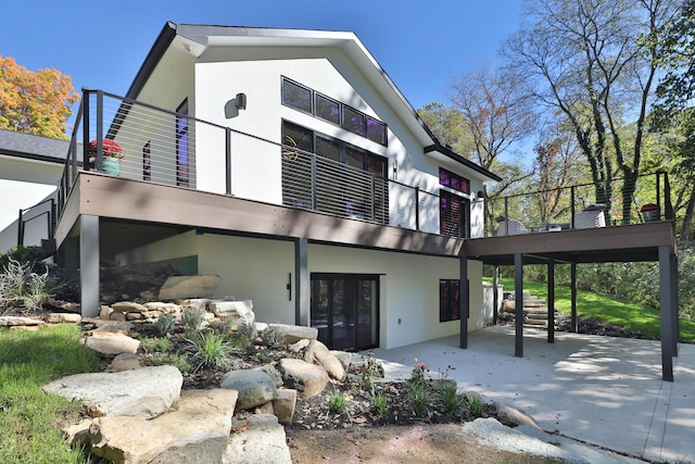 rear view of property featuring a patio and french doors