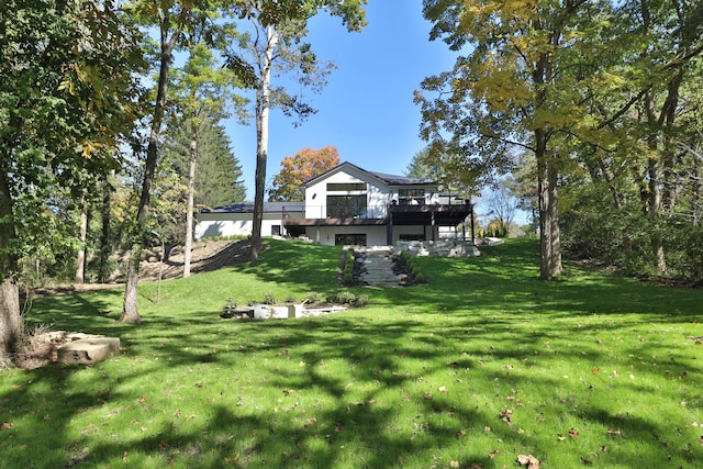 view of yard with a wooden deck